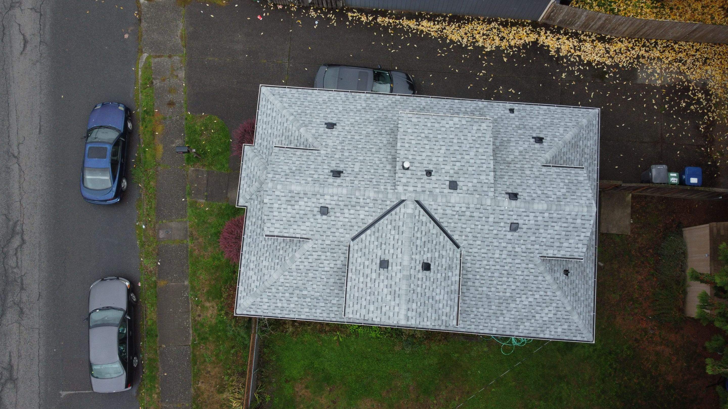 New Residential Roof picture with drone taken from above. New White shingles roof. Residential Roof Asphalt Shingle Roofs