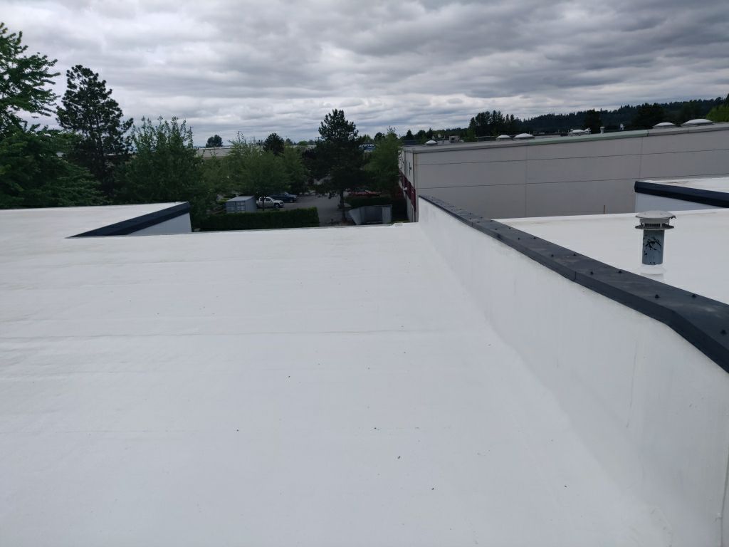 Full roof with liquid silicone for roof life extension in lynwood applied. Commercial system