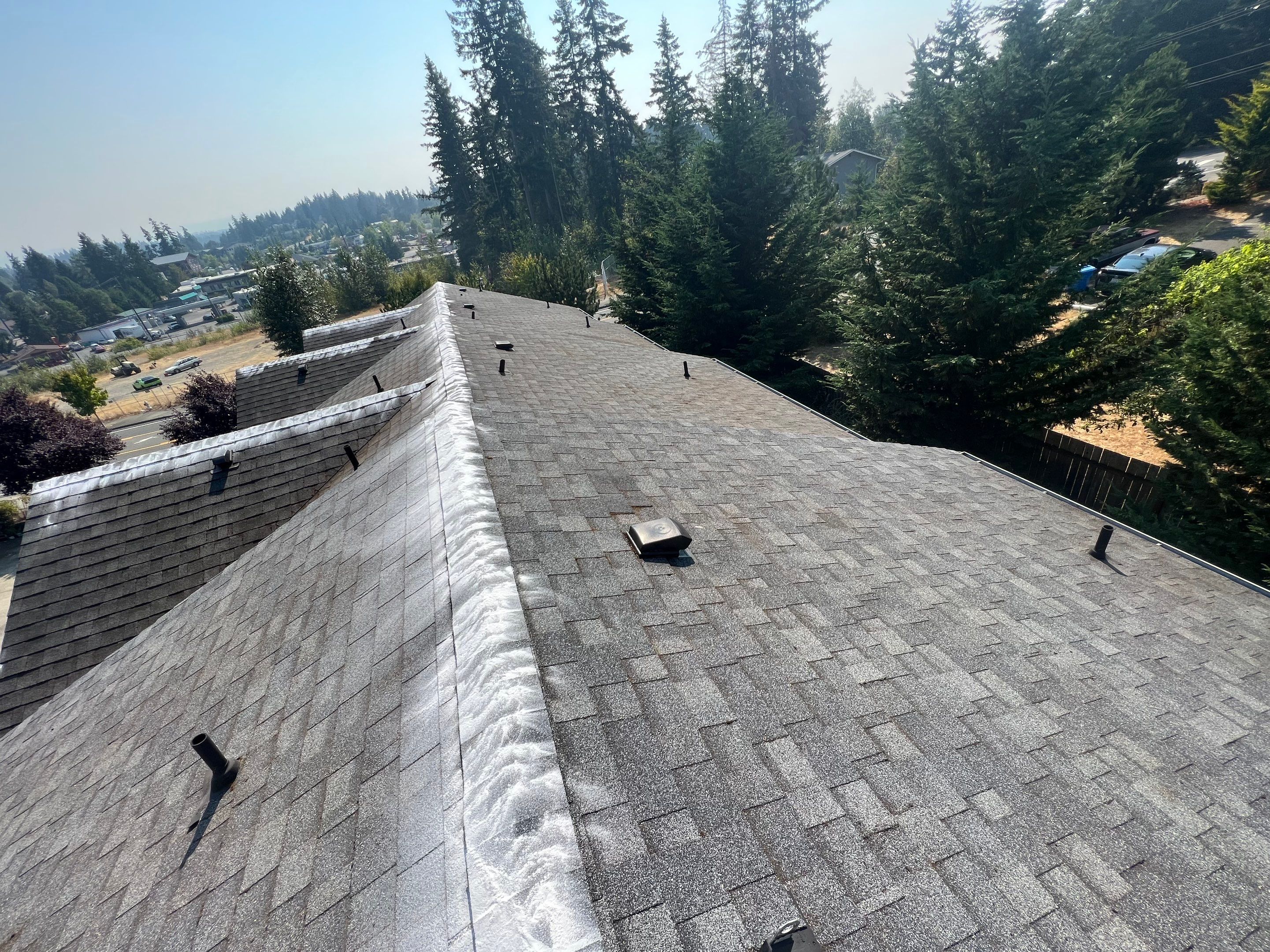 New clean residential roof in federal way with moss kill on it. Residential roof Benefits of Energy-Efficient Tips for Homes in High-Wind Areas