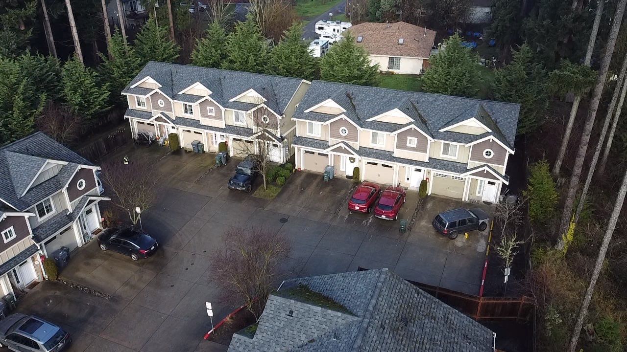 Houses with clean residential roofs located in Federal way. Dark Shingles taken from drone