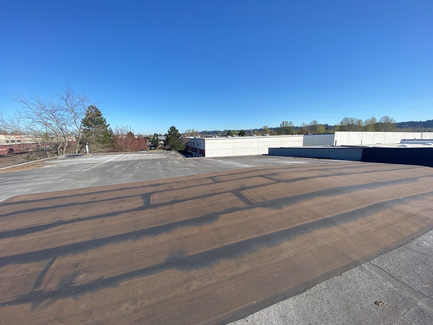 Commercial Roof in terrible condition before the application of liquid silicone.