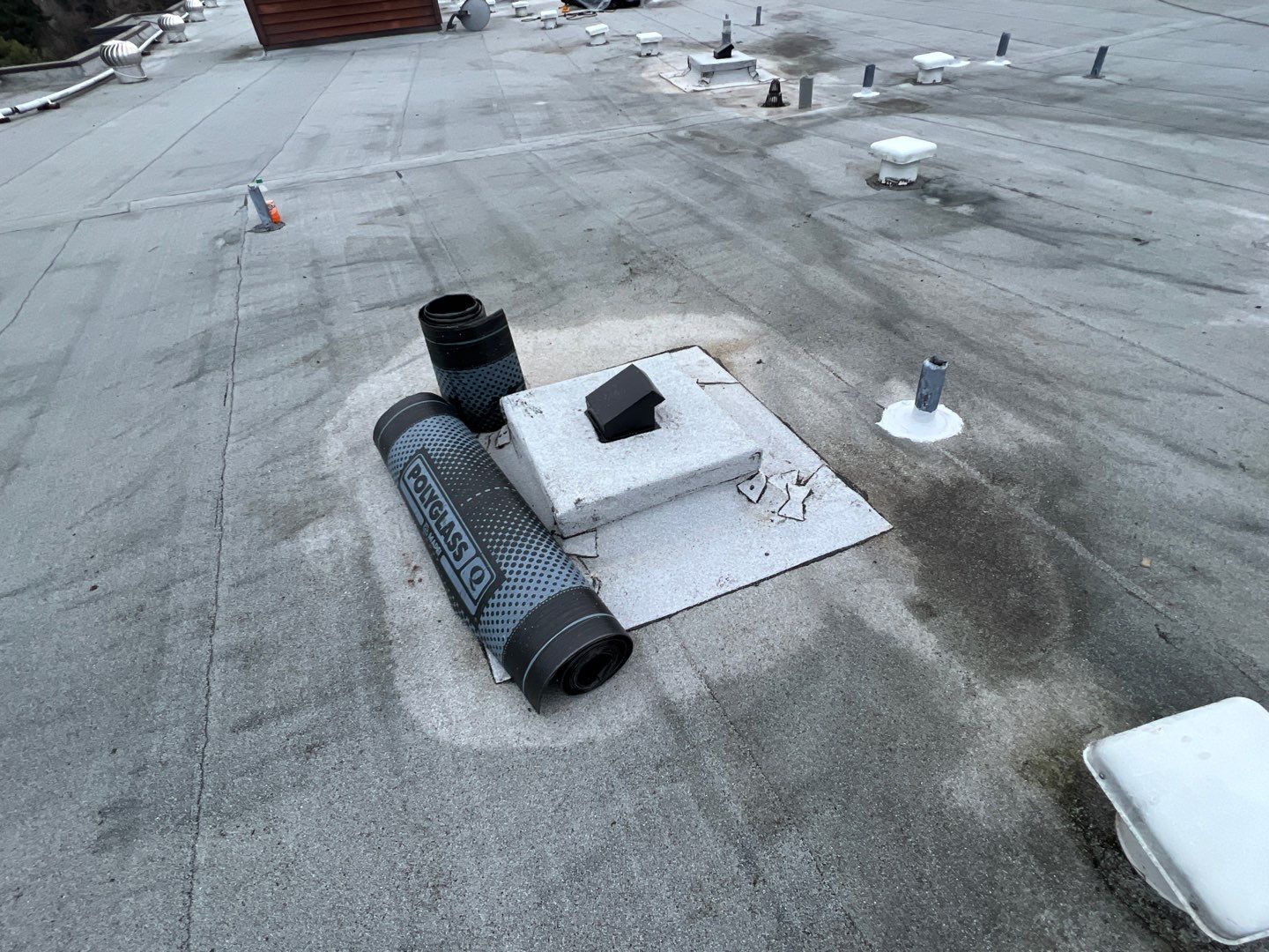 Box made for penetration with roll of torch down in a commercial roof maintenance in bellevue.