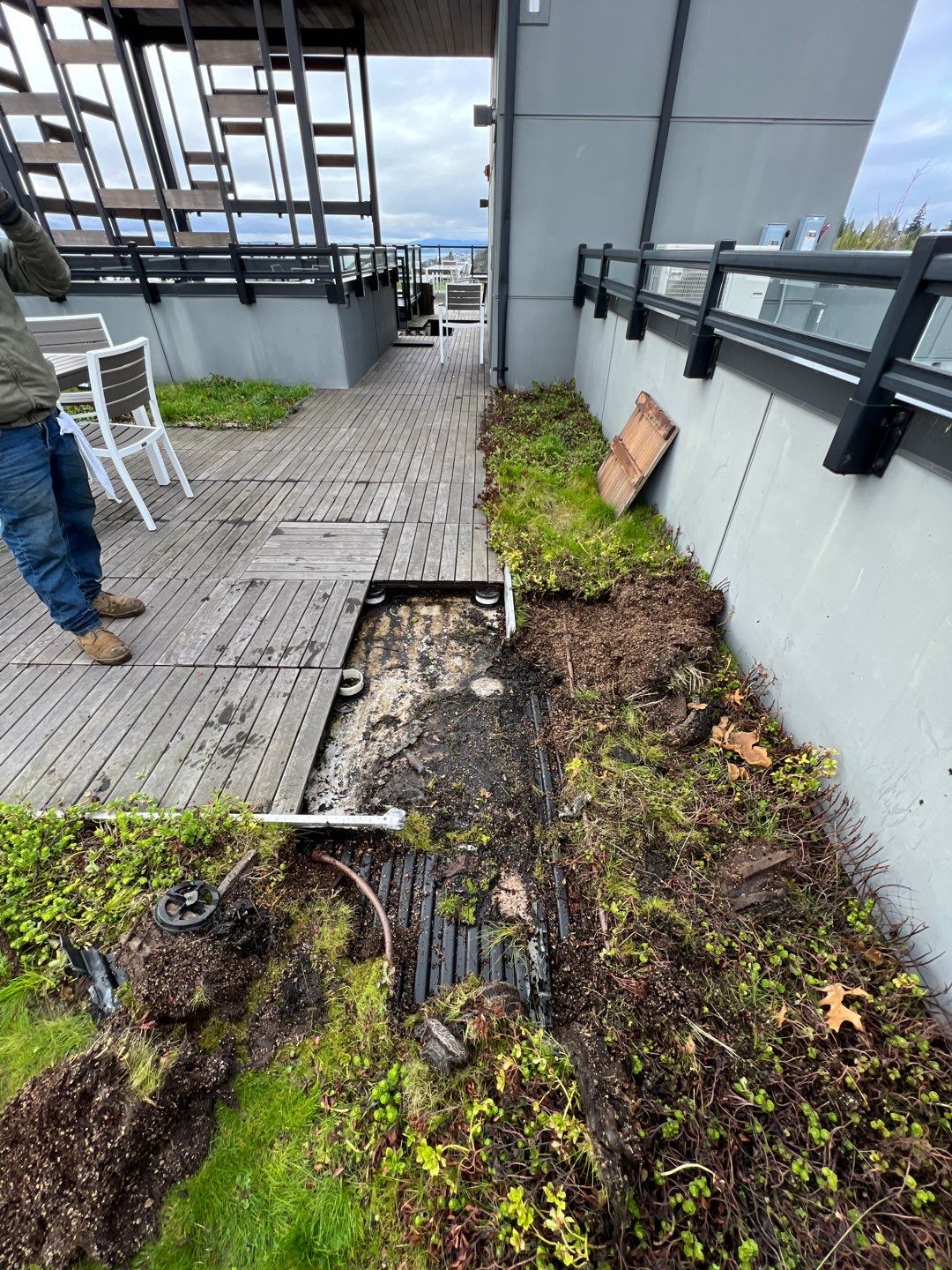 Roof repair team fixing a leak on a commercial building Roofing Maintenance Tips